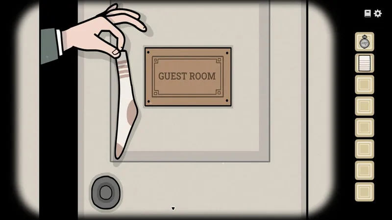 William's hand holding a dirty sock out of the guest room door