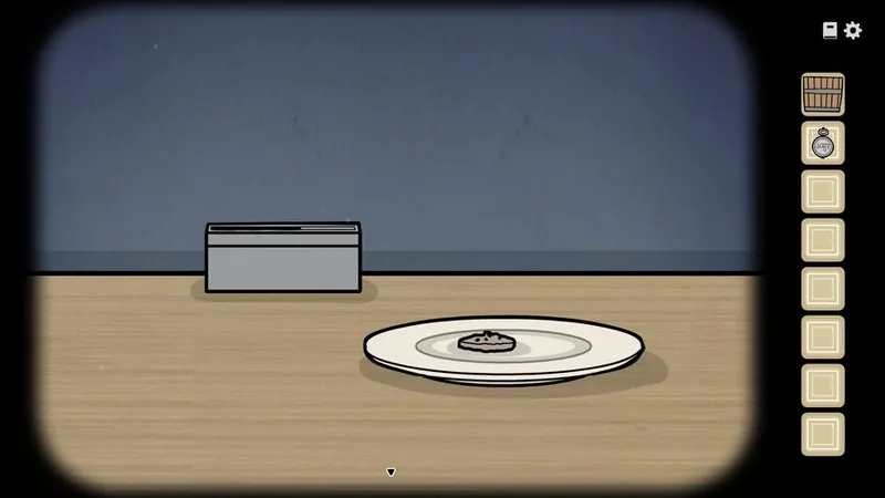 Table with a box and a cookie on a plate