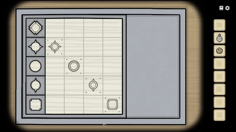 Silver slider box with five patterned blocks on a grid