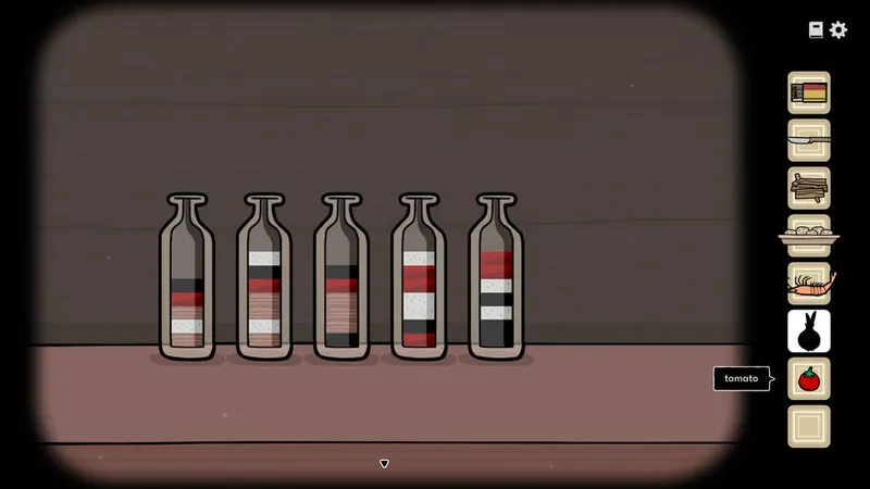Five bottles filled with layers of colored oil