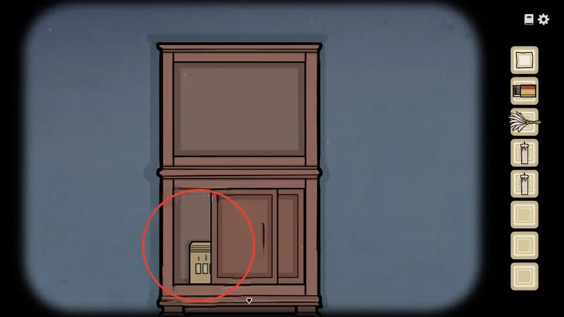 Cabinet with its lower door slid open and a locked box circled