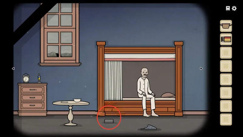 Aldous sitting on the edge of the bed with the silver box circled on the floor